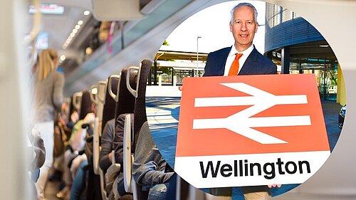 Gideon Amos with Wellington train station sign